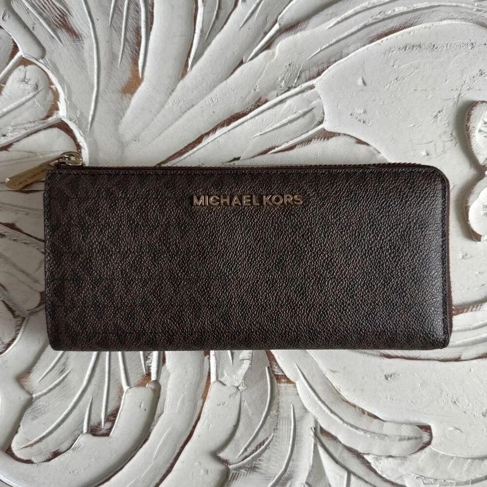 Michael Kors Jet Set Travel large logo continental zip-around wallet in a brown